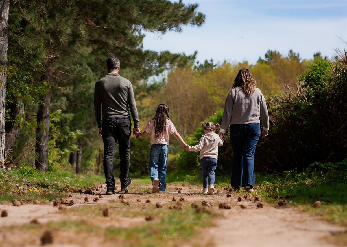Family walking through Needwood Forest during outdoor session