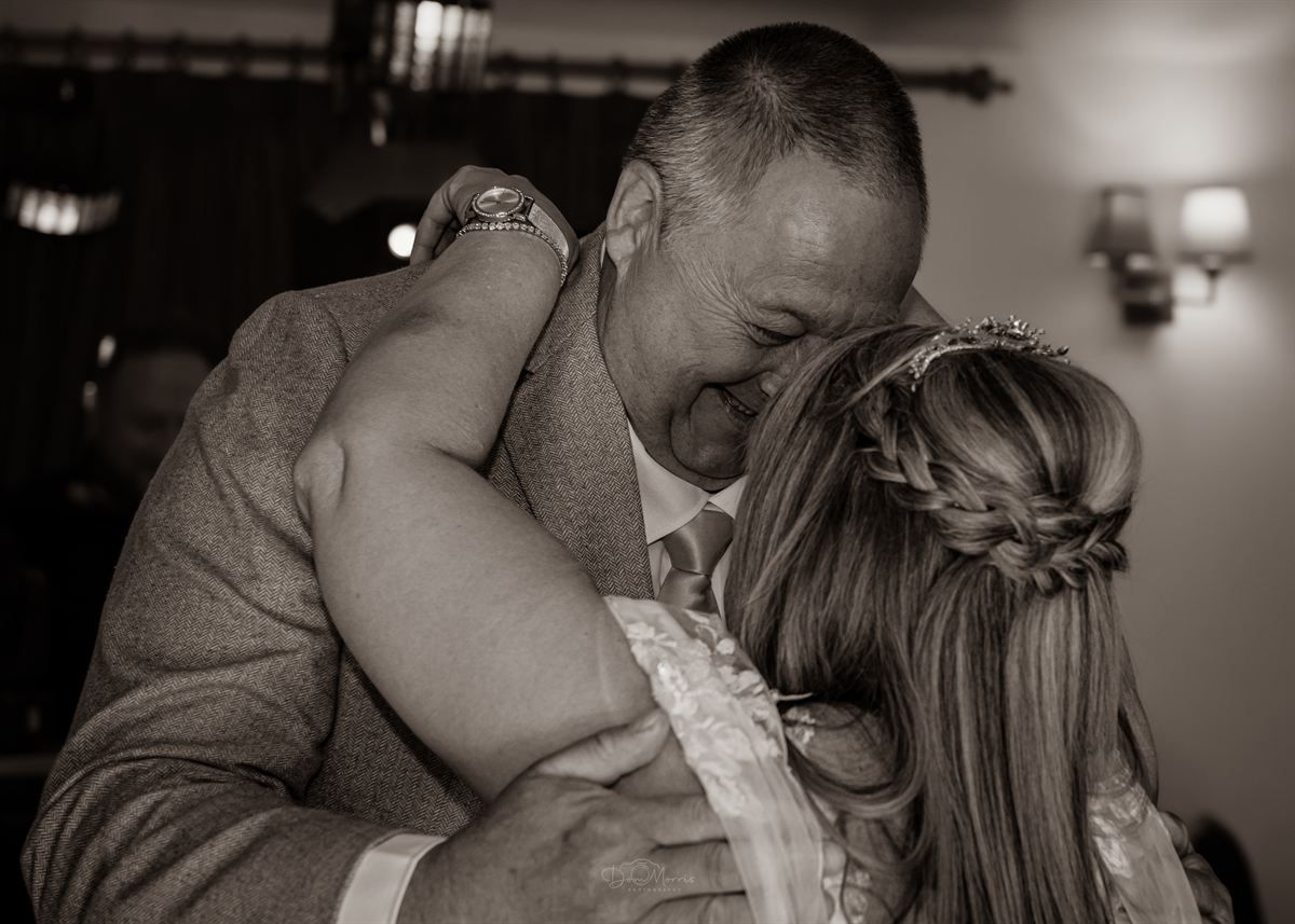 Groom seeing bride for first time walking down aisle