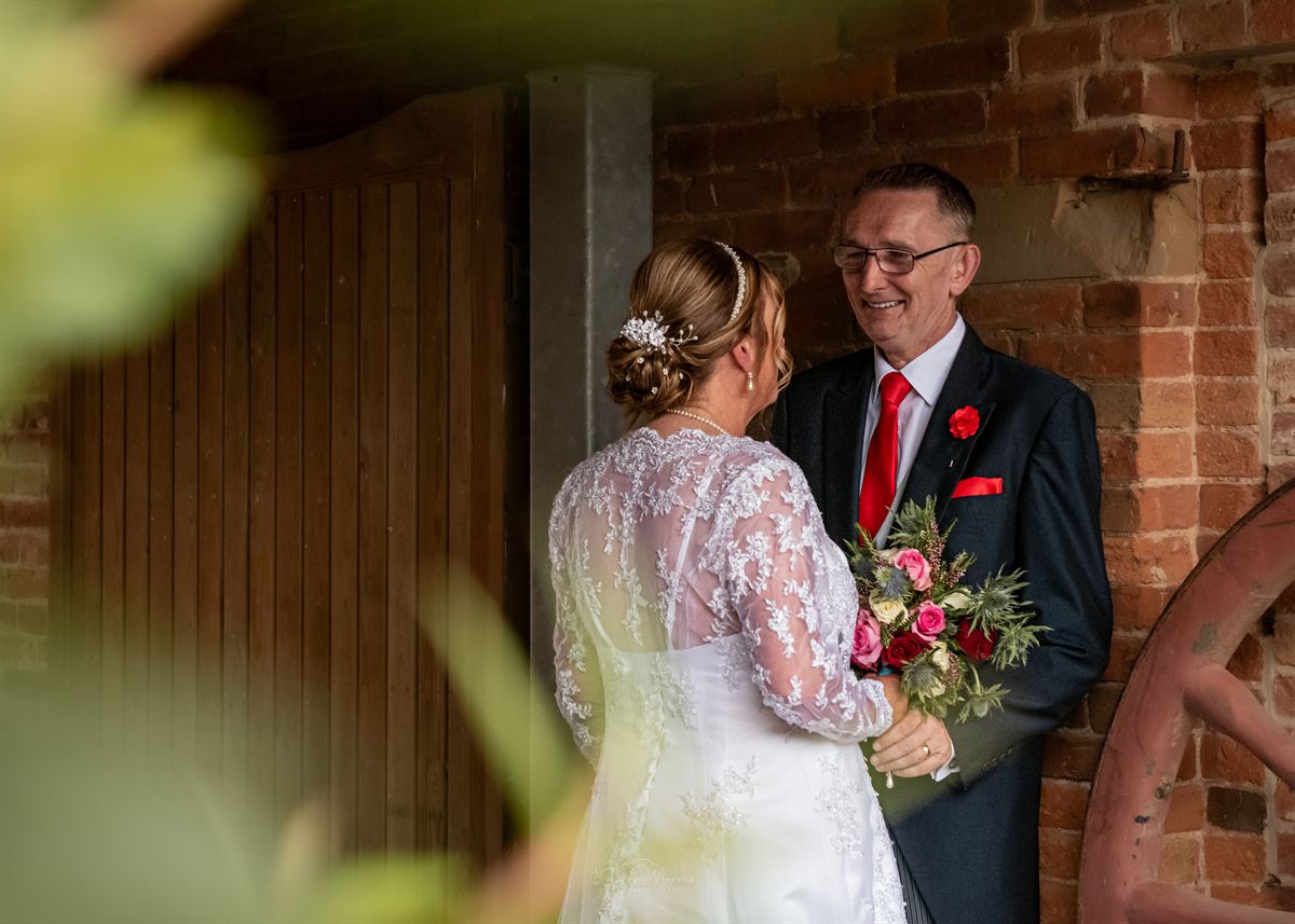 Wedding cake cutting moment at Burton-Upon-Trent reception